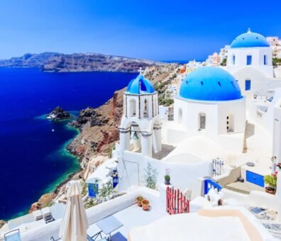Greece a scenic view of santorini, greece, showcasing its iconic white buildings and blue domes against clear sky comprehensive santorini travel guide insider tips, best beaches, budget ideas & 3-day itinerary