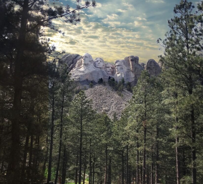 A View Of Mount Rushmore National Monument, Showcasing The Iconic Faces Of George Washington, Thomas Jefferson, Theodore Roosevelt, And Abraham Lincoln