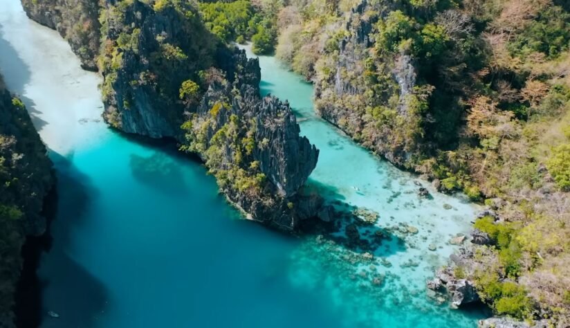 Aerial View Of The Turquoise Lagoon In Palawan, Philippines, Showcasing The Stunning Waters Of Misool Island, Raja Ampat