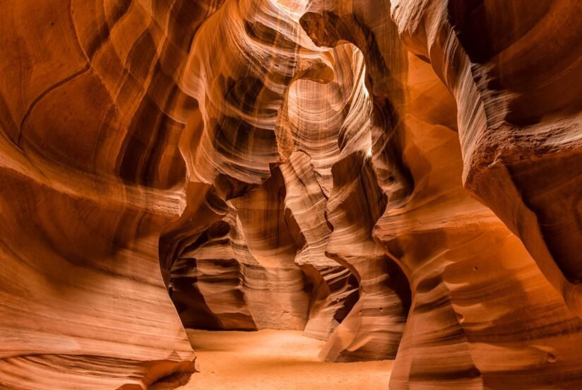 Lower Antelope Canyon In Arizona, Showcasing Stunning Red Rock Formations And Narrow Passageways Illuminated By Sunlight