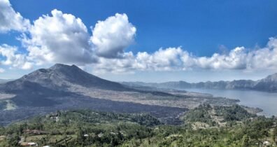  | indonesia scenic view from mount batur, showcasing sunrise over trunyan hill, highlighting bali's natural beauty and tranquility hill hike hidden trek for culture, solitude & epic views