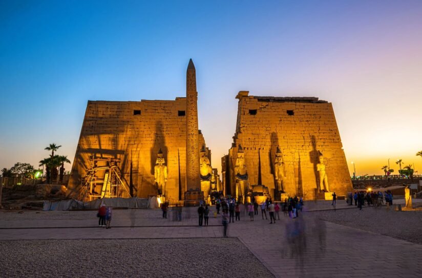The Temple Of Karnak And The Sphinx At Sunset, Casting Shadows Over Luxor Temple In Egypt's Serene Landscape