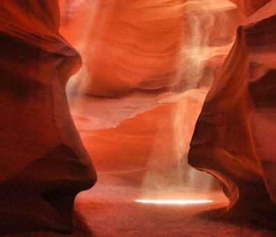 United states the sun shines through antelope canyon x in arizona, casting beautiful light patterns on smooth, sculpted rock surfaces a hidden gem arizona