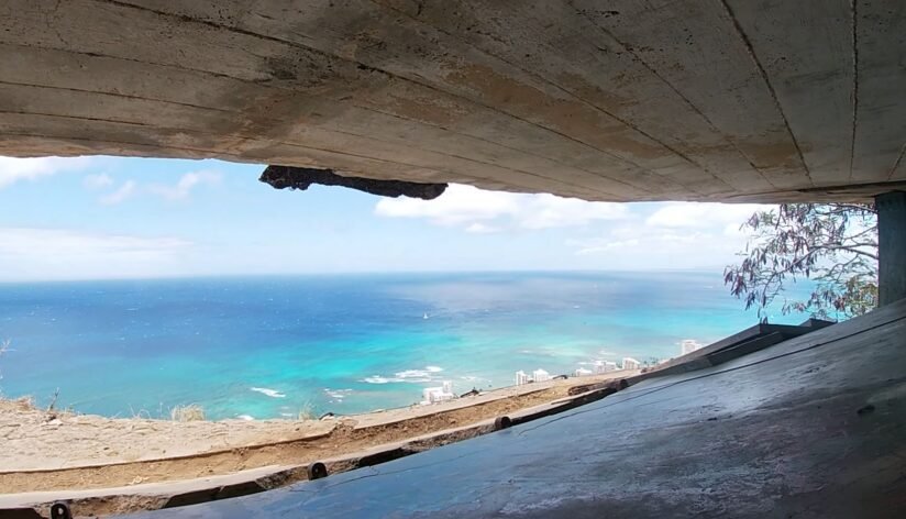 View Of The Ocean From Inside A Tunnel At Diamond Head State Monument, Showcasing Blue Waters And Rocky Cliffs